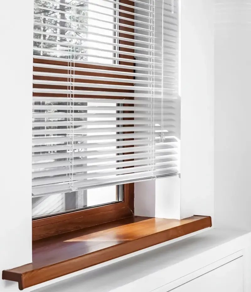 Venetian blinds on a window from Black Pearl Blinds who sells window coverings and blinds in Vancouver.